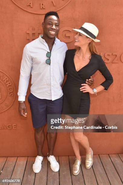 Rugby player Fulgence Ouedraogo and Actress Ariane Brodier attend the 2017 French Tennis Open - Day Nine at Roland Garros on June 5, 2017 in Paris,...