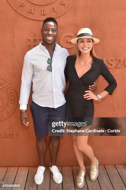 Rugby player Fulgence Ouedraogo and Actress Ariane Brodier attend the 2017 French Tennis Open - Day Nine at Roland Garros on June 5, 2017 in Paris,...