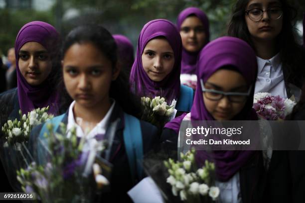 Pupils from Eden Girls' School in Waltham Forest take part in a vigil for the victims of the London Bridge terror attacks, in Potters Fields Park on...