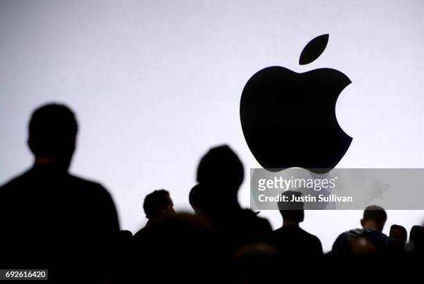 Attendees wait for the start of the 2017 Apple Worldwide Developer Conference at the San Jose Convention Center on June 5, 2017 in San Jose,...