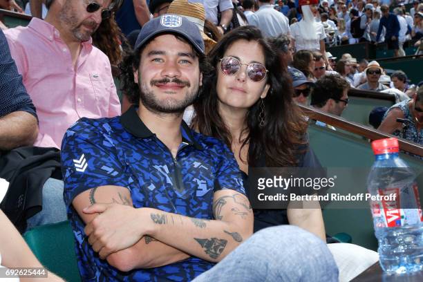 Actress Cristiana Reali and guest attend the 2017 French Tennis Open - Day Height at Roland Garros on June 4, 2017 in Paris, France.