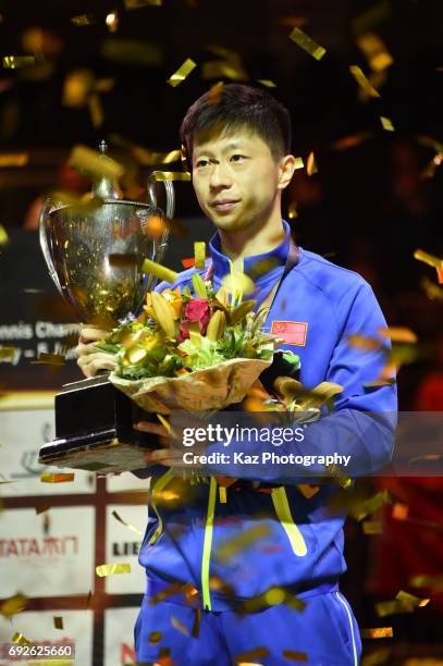 Ma Long of China holds the cup as he won the Men's Single during the Table Tennis World Championship at Messe Duesseldorf on June 5, 2017 in...