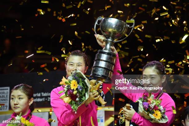 Ding Ning and Liu Shiwen of China hold the cup as they won Women's Doubles during the the Table Tennis World Championship at Messe Duesseldorf on...