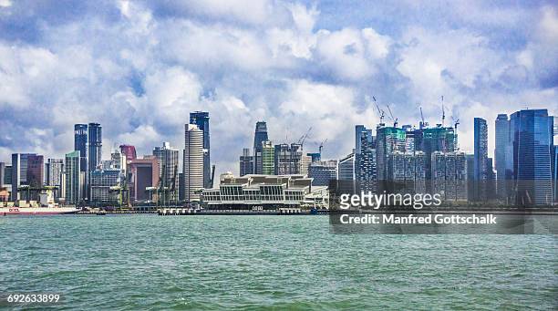 port of singapore with city skyline - singapore cruise centre stock pictures, royalty-free photos & images