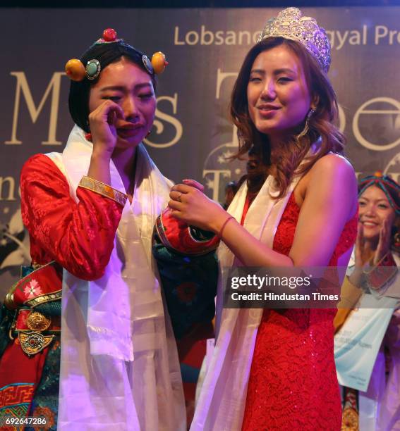 Miss Tibet 2016 Tenzin Sangnyi crowns Miss Tibet 2017 Tenzin Paldon at Mcleodganj on June 4, 2017 near Dharamsala, India. Nine participants took part...