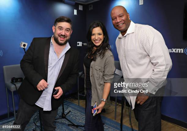 Hosts Ryan Sampson, Nicole Ryan and Stanley T pose for a photo during "The Morning Mash Up" on SiriusXM Hits 1 Channel at SiriusXM Studios on June 5,...