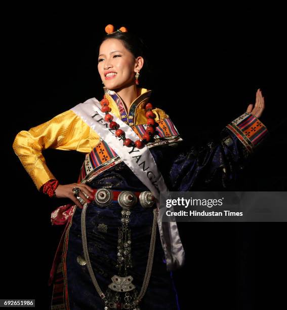 Contestants of the Miss Tibet Beauty Pageant pose during the Traditinol round at Mcleodganj on June 4, 2017 near Dharamsala, India. Nine participants...