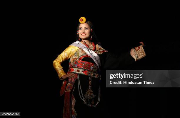 Contestants of the Miss Tibet Beauty Pageant pose during the Traditinol round at Mcleodganj on June 4, 2017 near Dharamsala, India. Nine participants...