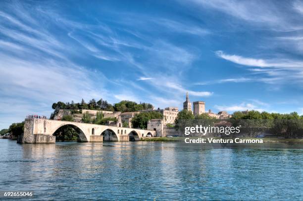 view over the rhône river looking northeast, with the bridge pont saint-bénézet or "pont d'avignon". - rhone stock pictures, royalty-free photos & images