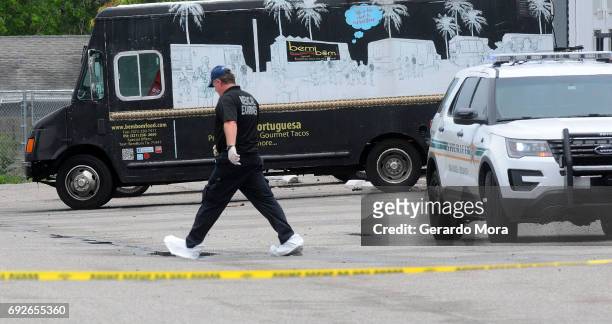 Investigators work the scene of a multiple shooting at an area business in an industrial area on June 5, 2017 northeast of downtown Orlando, Florida....