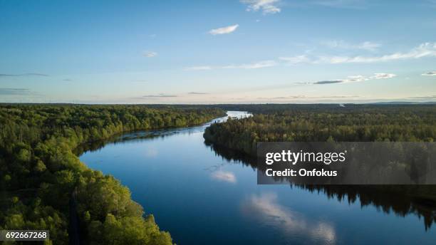 aerial nature landscape flying over river at sunset - river stock pictures, royalty-free photos & images