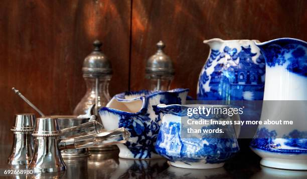 blue and white porcelain in an old cupboard. - porcelain stock pictures, royalty-free photos & images