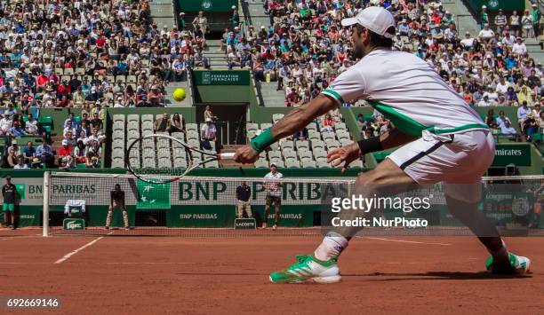 Fernando Verdasco of Spain returns the ball to Kei Nishikori of Japan during the fourth round at Roland Garros Grand Slam Tournament - Day 9 on June...