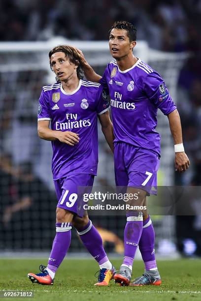 Cristiano Ronaldo of Real Madrid CF celebrates with his team mate Luka Modric after scoring his team's third goal during the UEFA Champions League...