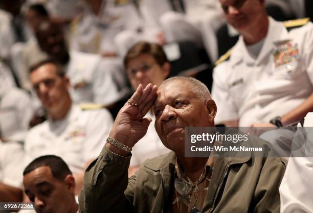 Battle of Midway veteran U.S. Navy retired 3rd Class Petty Officer William Fentress salutes during an event at the U.S. Naval Memorial marking the...