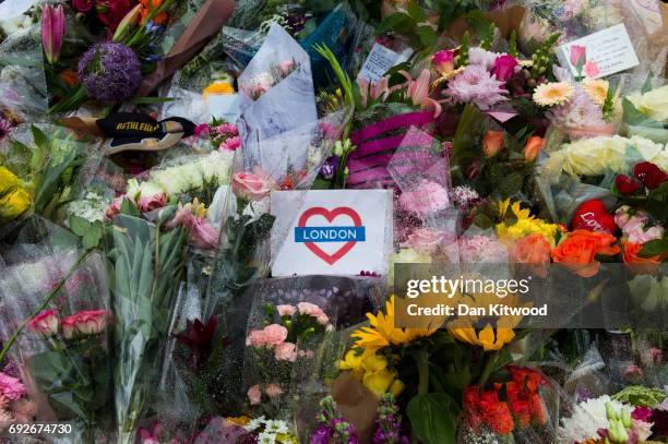 Flowers are laid on the south side of London Bridge close to Borough Market, in tribute to the victims of the June 3rd attacks, on June 5, 2017 in...