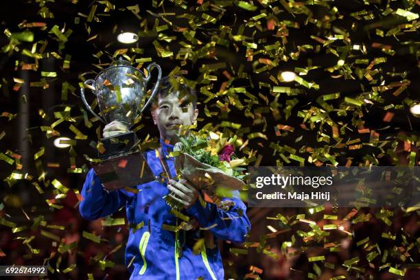 Ma Long of China holds the trophy during celebration ceremony of Men's Singles at Table Tennis World Championship at Messe Duesseldorf on June 5,...