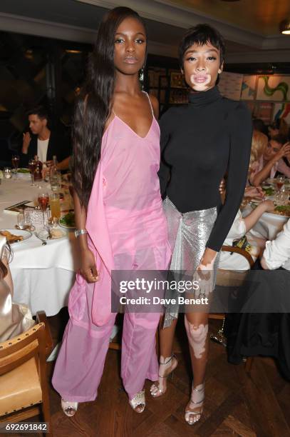 Leomie Anderson and Winnie Harlow attend the Wonderland Summer Issue dinner hosted by Madison Beer at The Ivy Soho Brasserie on June 5, 2017 in...