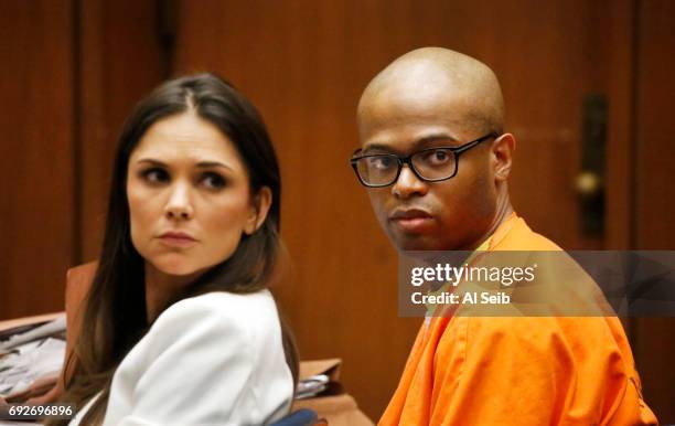 Ezeoma Chigozie Obioha, right, with one of his attorneys' Meghan Blanco, left, watches his other attorney Edi M.O. Faal asks for a new trial as he...