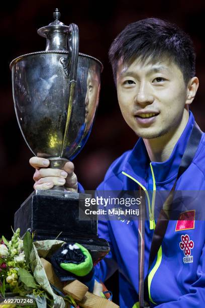 Ma Long of China poses with a trophy during celebration ceremony of Men's Singles at Table Tennis World Championship at Messe Duesseldorf on June 5,...