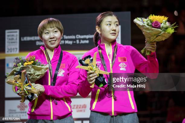 Meng Chen of China and Yuling Zhu of China pose with a silver medal during celebration ceremony of Women's Doubles of Japan at Table Tennis World...