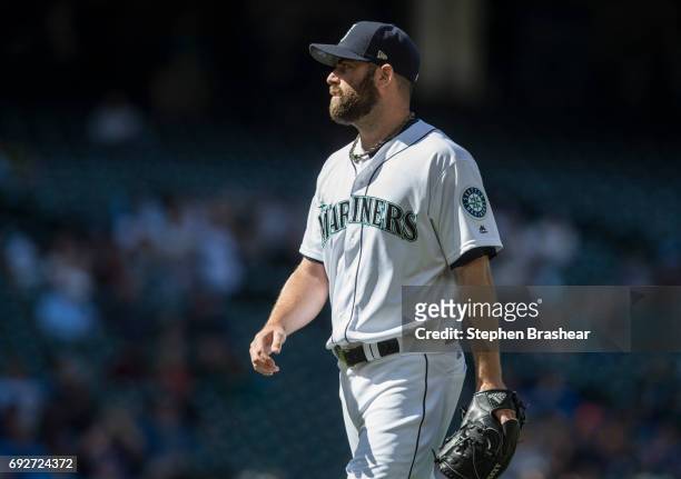 Relief pitcher Tony Zych of the Seattle Mariners walks off the field after pitching an inning during a game Colorado Rockies at Safeco Field on June...