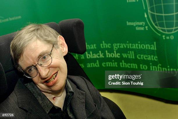 Physicist Stephen Hawking smiles during a symposium in honor of his birthday at the University of Cambridge January 11, 2002 in Cambridge, England....