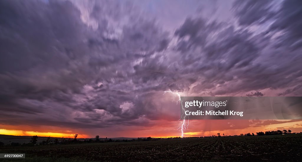 A Fast Moving African Thunderstorm with a Forked Lightning Strike at Sunset, Magaliesburg, Gauteng Province, South Africa