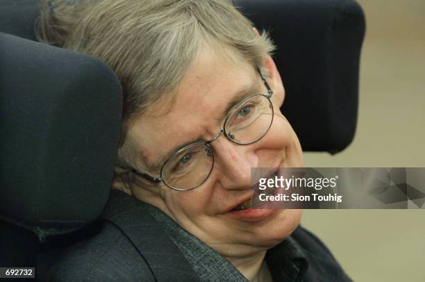 Physicist Stephen Hawking smiles at a symposium to honor his birthday at the Center for Mathematical Sciences at the University of Cambridge January...