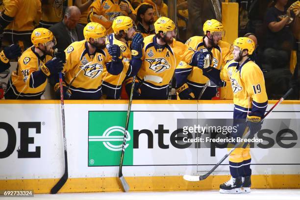 Calle Jarnkrok of the Nashville Predators celebrates with his teammates after scoring a goal against Matt Murray of the Pittsburgh Penguins during...