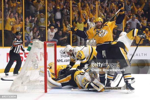 Craig Smith celebrates after Calle Jarnkrok of the Nashville Predators scored a goal against Matt Murray of the Pittsburgh Penguins during the first...