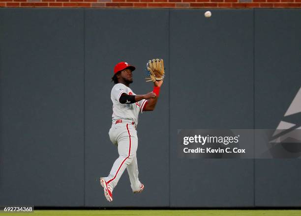 Odubel Herrera of the Philadelphia Phillies catches a line out hit by Tyler Flowers of the Atlanta Braves in the second inning at SunTrust Park on...