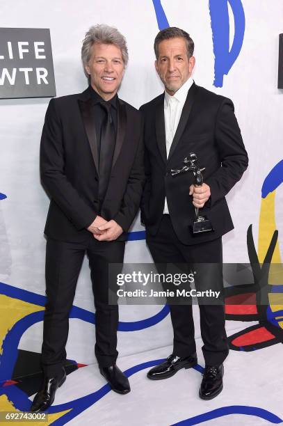 Jon Bon Jovi poses with designer Kenneth Cole, winner of the Social Impact Award on the Winners Walk during the 2017 CFDA Fashion Awards at...