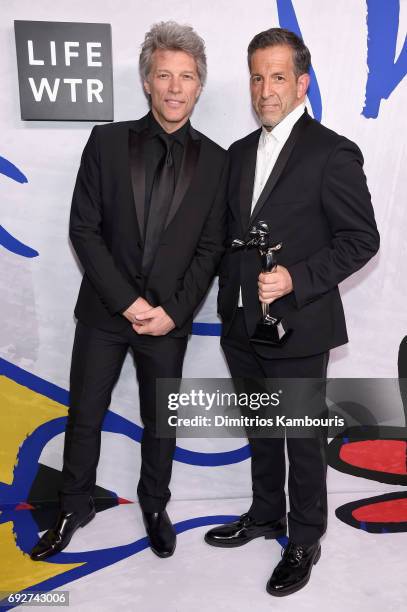 Jon Bon Jovi poses with designer Kenneth Cole, winner of the Social Impact Award on the Winners Walk during the 2017 CFDA Fashion Awards at...