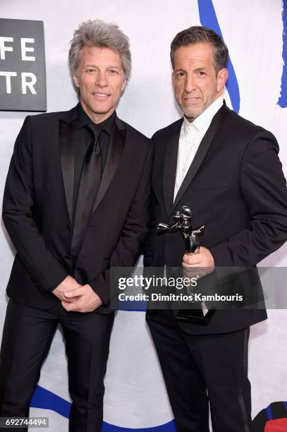 Jon Bon Jovi poses with designer Kenneth Cole, winner of the Social Impact Award on the Winners Walk during the 2017 CFDA Fashion Awards at...