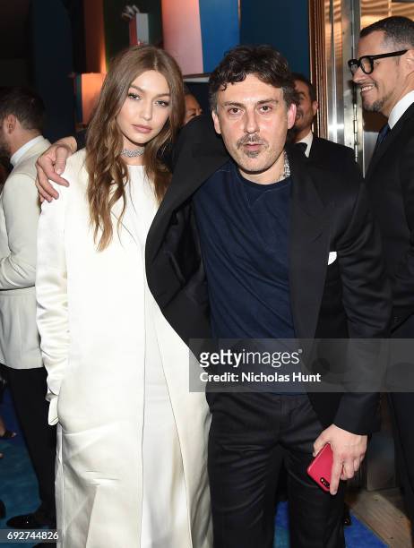 Gigi Hadid and Stuart Weitzman Creative Director Giovanni Morelli attends the 2017 CFDA Fashion Awards Cocktail Hour at Hammerstein Ballroom on June...