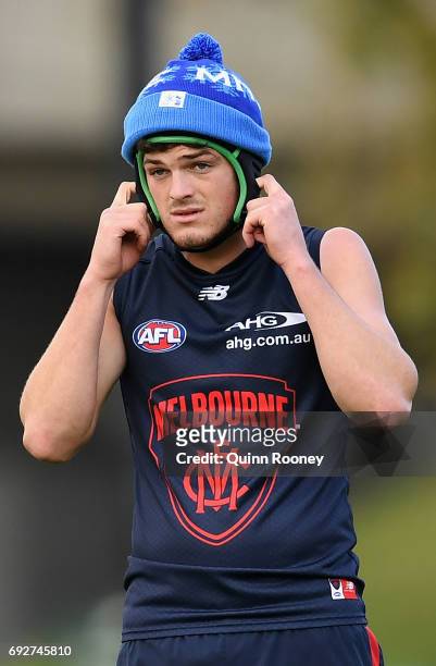 Angus Brayshaw of the Demons wears a helmet under his beanie during a Melbourne Demons AFL training session at Gosch's Paddock on June 6, 2017 in...