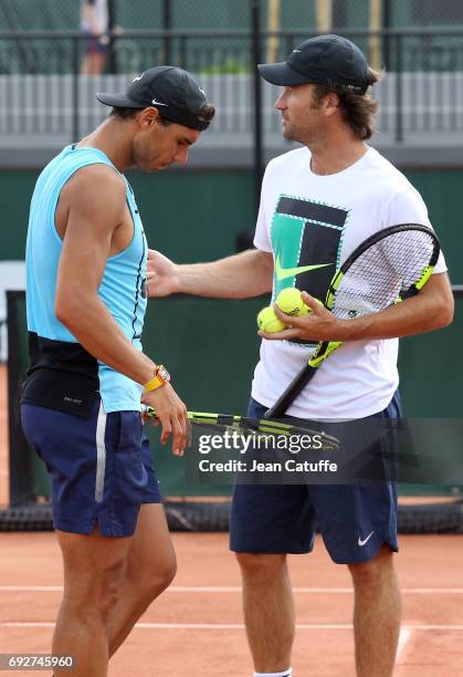 Rafael Nadal of Spain and assistant coach Carlos Moya during practice on day 9 of the 2017 French Open, second Grand Slam of the season at Roland...