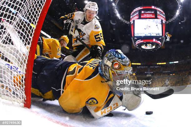 Pekka Rinne of the Nashville Predators makes a glove save against Jake Guentzel of the Pittsburgh Penguins during the second period in Game Four of...