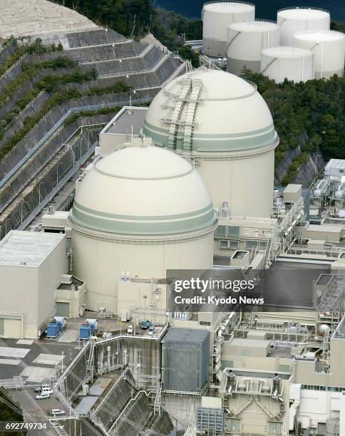 File photo taken in March 2017 shows the No. 3 and 4 reactors of Kansai Electric Power Co.'s Takahama nuclear plant on the Sea of Japan coast in...