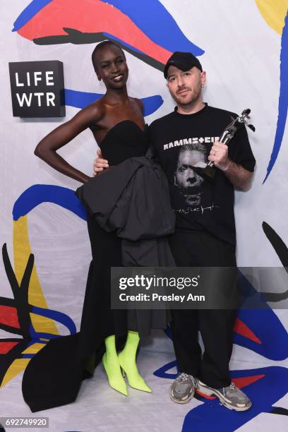 Model Alek Wek and designer Demna Gvasalia for Vetements and Balenciaga poses with International Award on the Winners Walk during 2017 CFDA Fashion...