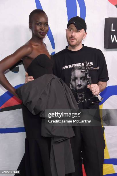 Model Alek Wek and designer Demna Gvasalia for Vetements and Balenciaga poses with International Award on the Winners Walk during 2017 CFDA Fashion...