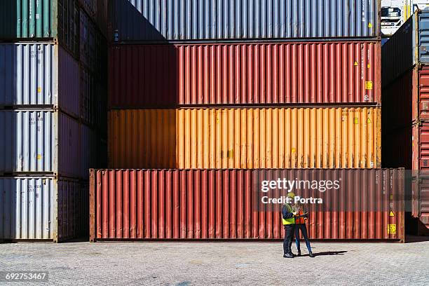 workers having discussion against cargo containers - cargo container stock pictures, royalty-free photos & images