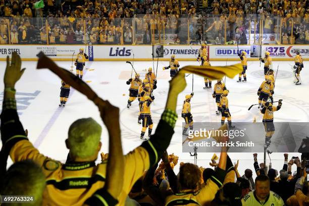 Fans cheer as the Nashville Predators celebrate after defeating the Pittsburgh Penguins with a score of 4 to 1 in Game Four of the 2017 NHL Stanley...