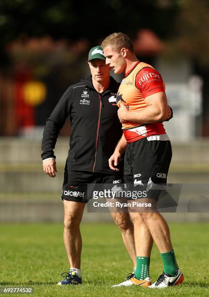 Michael Maguire, coach of the Rabbitohs speaks to George Burgess of the Rabbitohs during the South Sydney Rabbitohs NRL training session at Redfern...