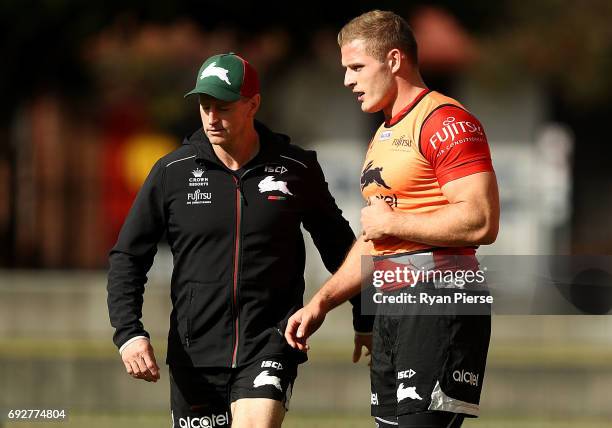 Michael Maguire, coach of the Rabbitohs speaks to George Burgess of the Rabbitohs during the South Sydney Rabbitohs NRL training session at Redfern...