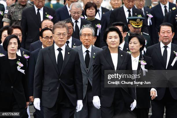 South Korean President Moon Jae-in and his wife Kim Jung-suk attend a ceremony marking Korean Memorial Day at the Seoul National cemetery on June 6,...