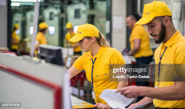 computer checking in warehouse - mailroom stock pictures, royalty-free photos & images