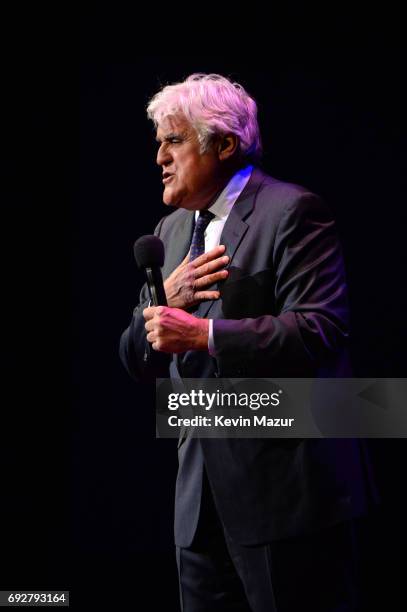 Jay Leno performs on stage during the National Night Of Laughter And Song event hosted by David Lynch Foundation at the John F. Kennedy Center for...