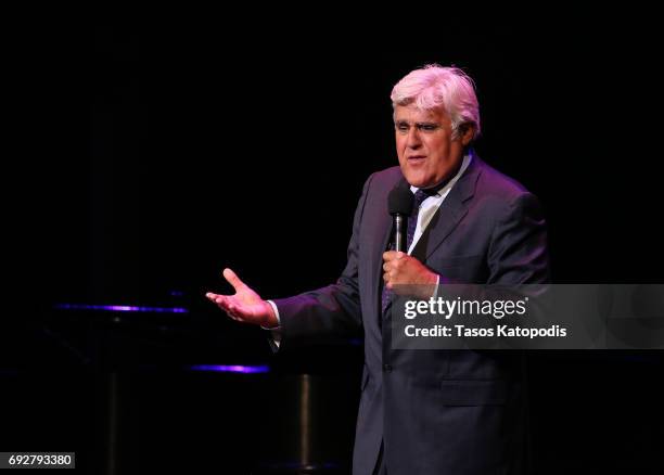 Jay Leno performs on stage during the National Night Of Laughter And Song event hosted by David Lynch Foundation at the John F. Kennedy Center for...